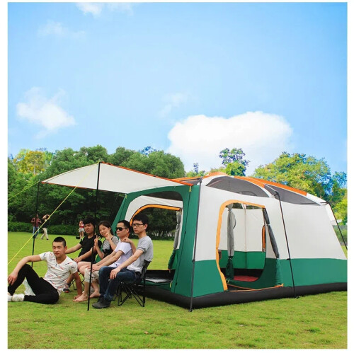 The BaseCamp Tent fully set up in a beautiful forest campground, showing its spacious size
